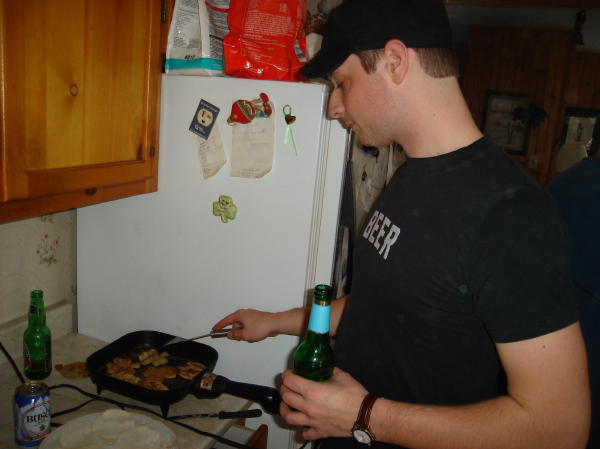 On to the frying pan. Kevin is using the beer as a counter balance, not as a cooking oil