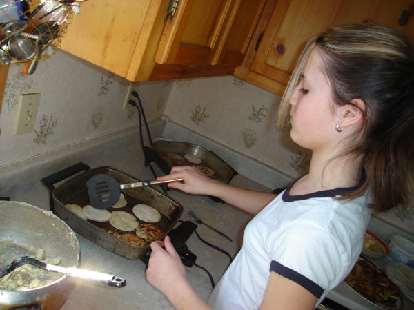 Sarah watching over two pans with no counter balance required.